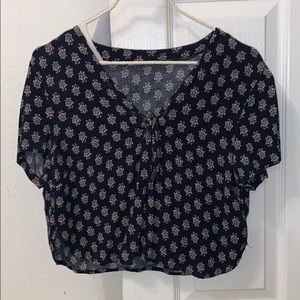 a cropped flower shirt with a tie!